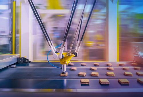A machine is making cookies on the assembly line.