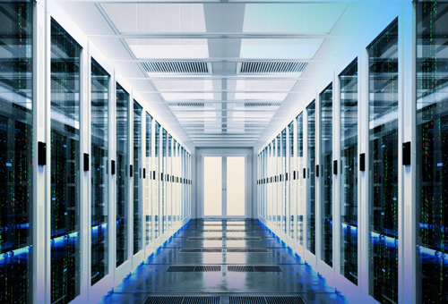 A long hallway with many racks of server equipment.