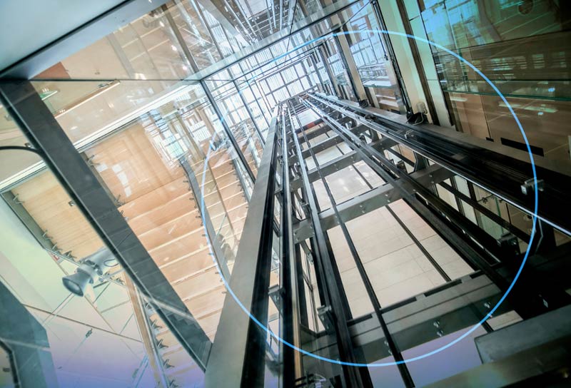 A view of an escalator from the ground up.