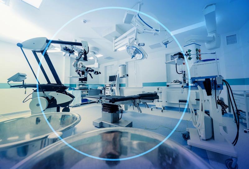 A view of an operating room with many medical equipment.