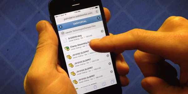 A person is holding their phone and typing on it.