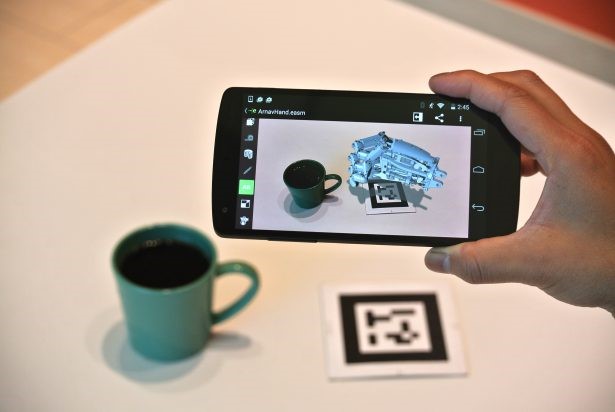 A person is taking a picture of a coffee cup.