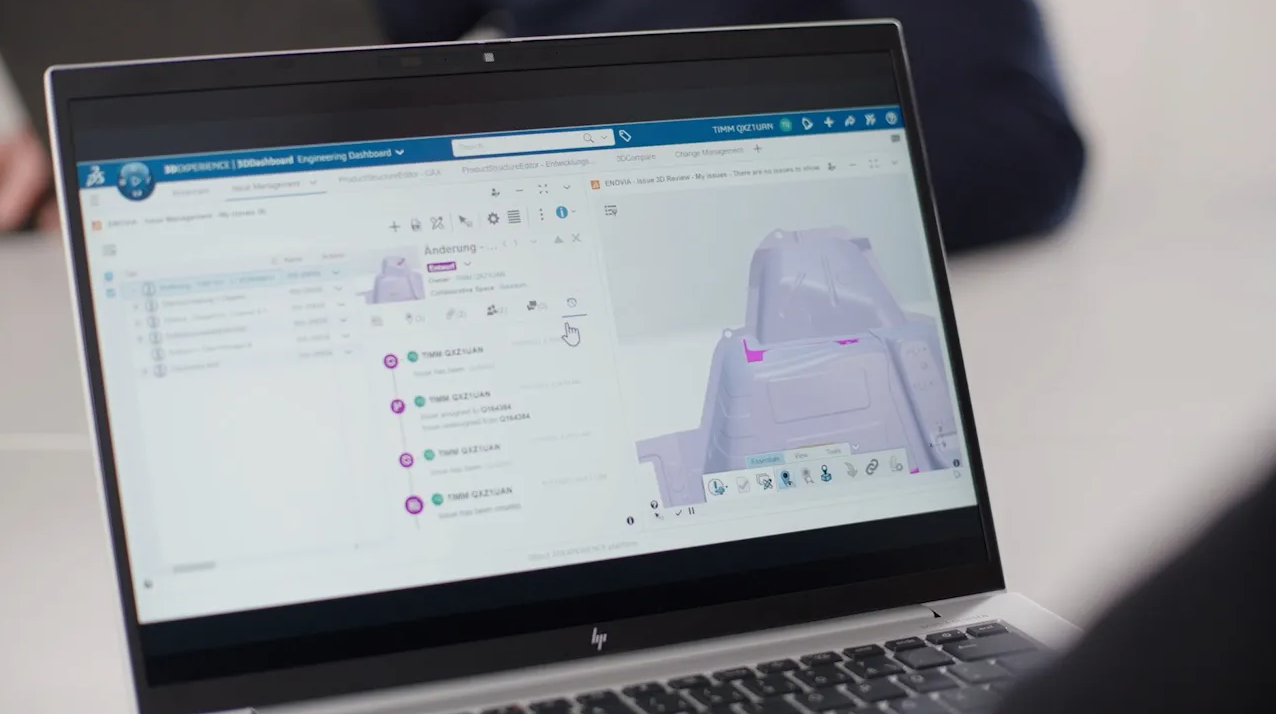 A laptop with a computer screen showing an image of a building.
