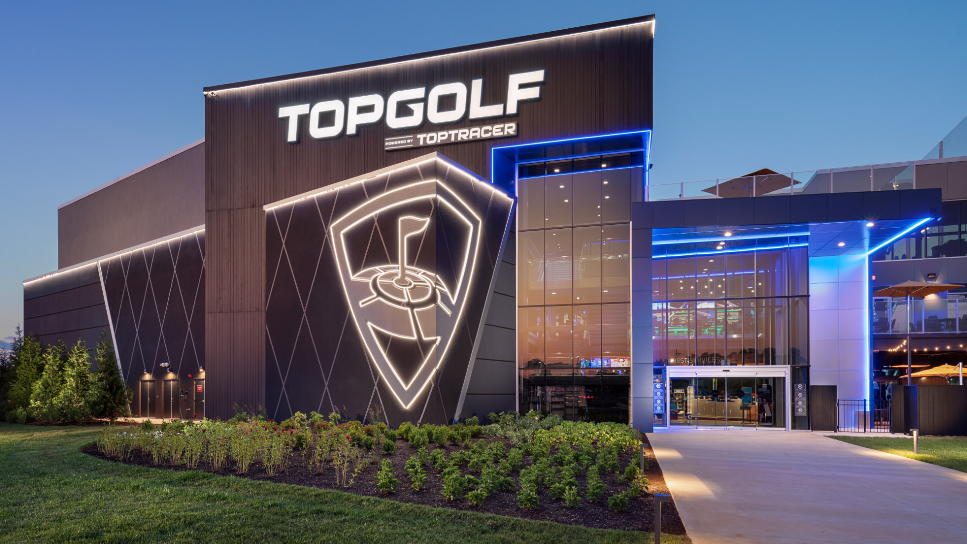 A building with the name topgolf on it.