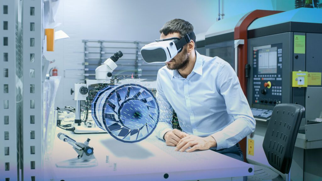 A man wearing vr glasses in front of an engine.